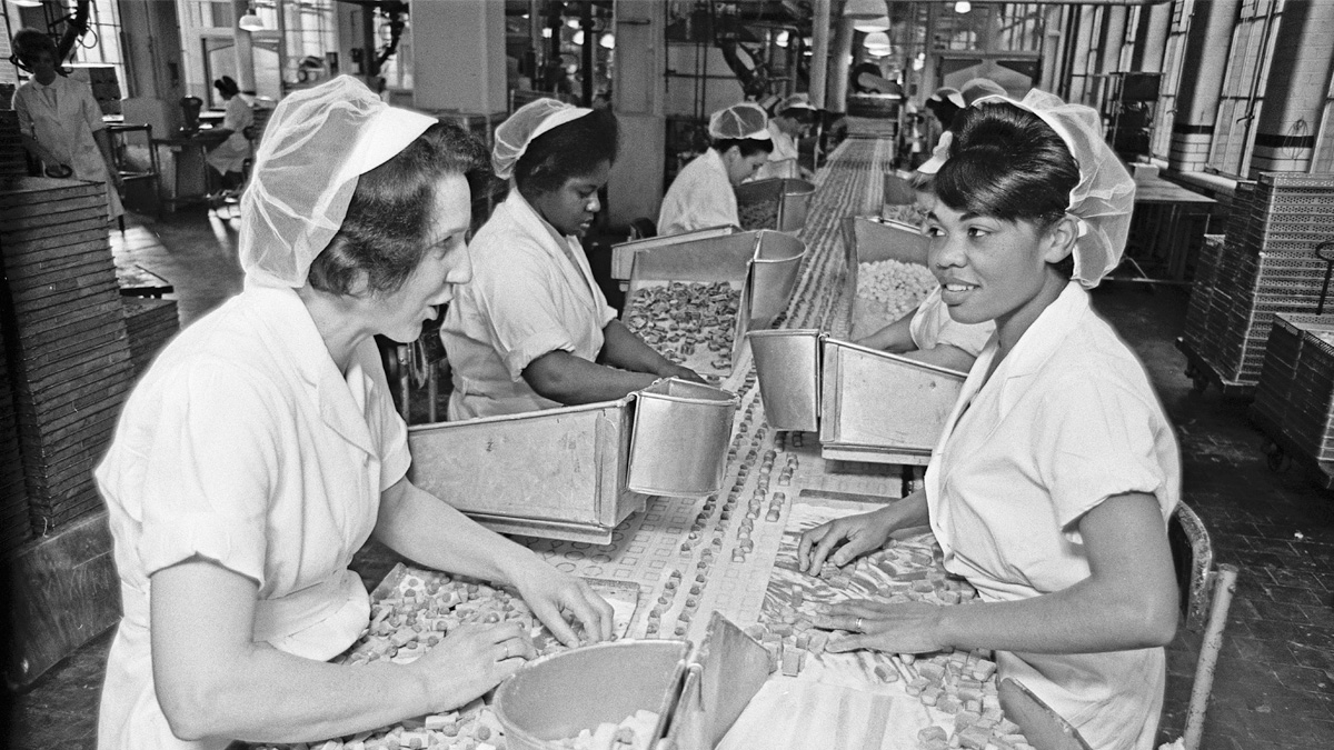 Woman on a Cadbury production line in 1967 [Image: Staff/Mirrorpix via Getty Images]